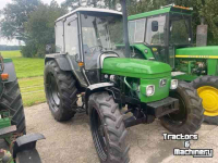 Tractors John Deere 1950 MC-1 cab.